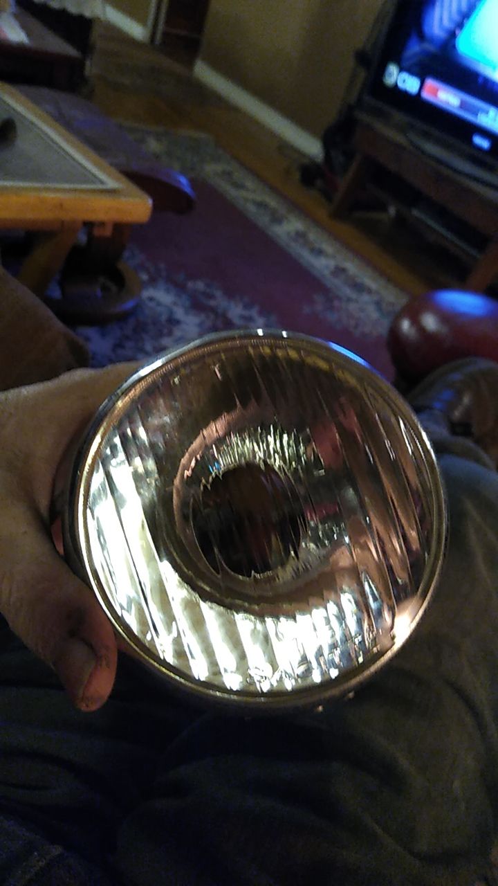 nice metal reflector and lightly dinged and weathered correct rim w/ halogen bulb to be installed in Siem bulb holder