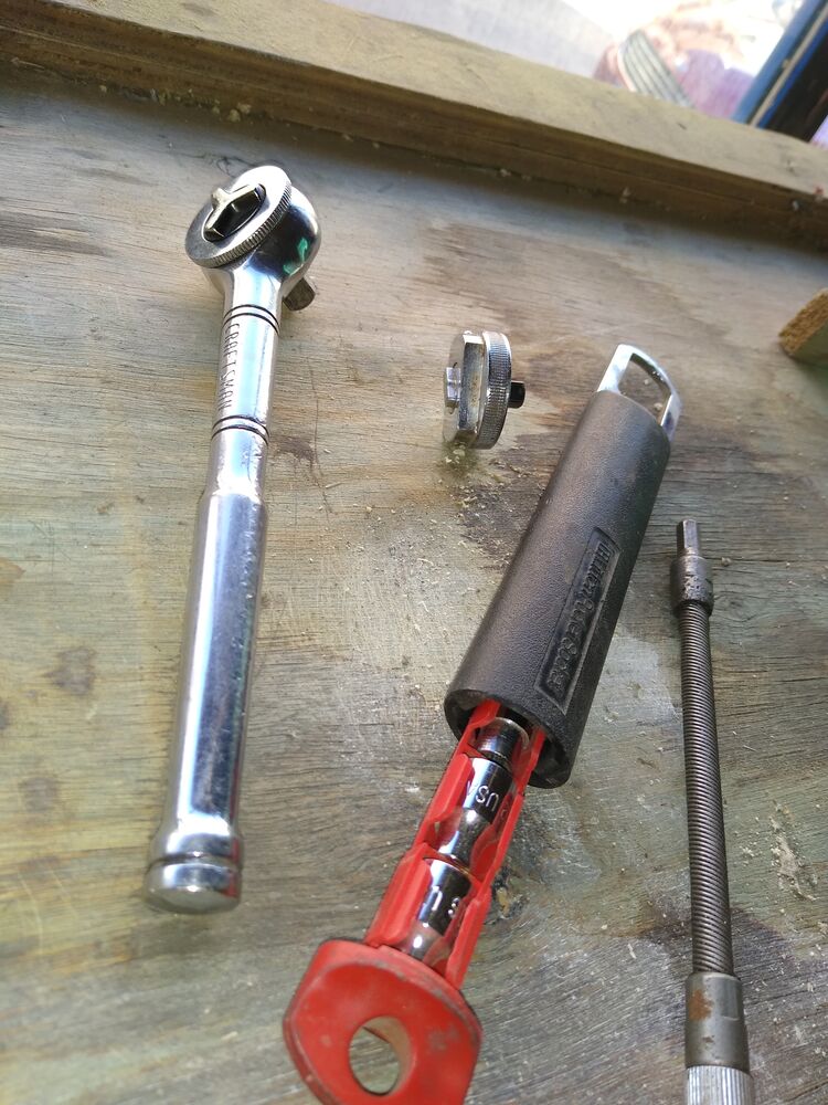 Here are the ratchets, a dependable Craftsman w/ the nice thumbwheel and fine resolution too for 3/8". For quarter inch I have a miniature Craftsman and this one that rides with me- sockets in handle and detachable mini finger wheel. Also nice flex e