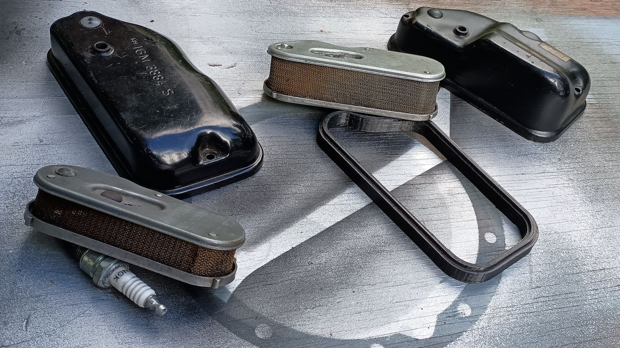 Comparing original filter & cover you can see the new cover is taller than the original but the riser is still needed.