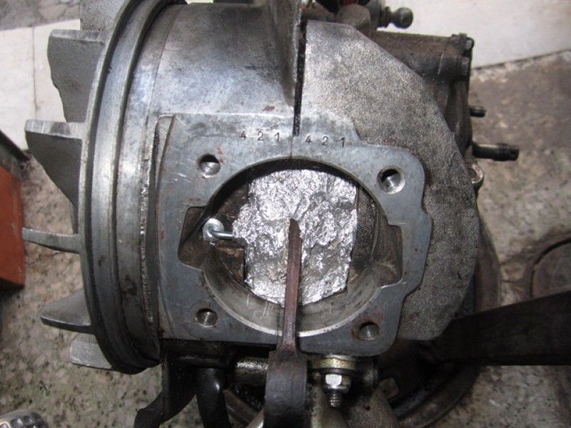 First I used aluminum foil to make a 'dam' closing off the crankcase. I plugged the oil hole with a snug fitting pop rivet.