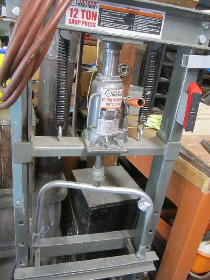 Bending a slight dip in the middle insures it won't hi center and bike won't rock a little from side to side