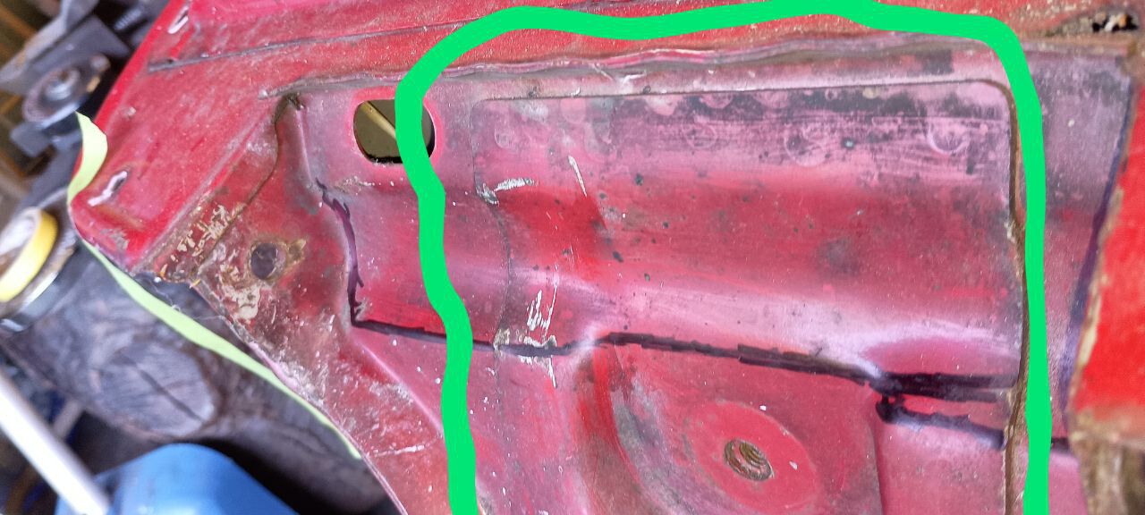 you can see the small pocket and where I've marked it to cut for enlarging across that thick reinforcing plate that was part of the 4T motor mount system