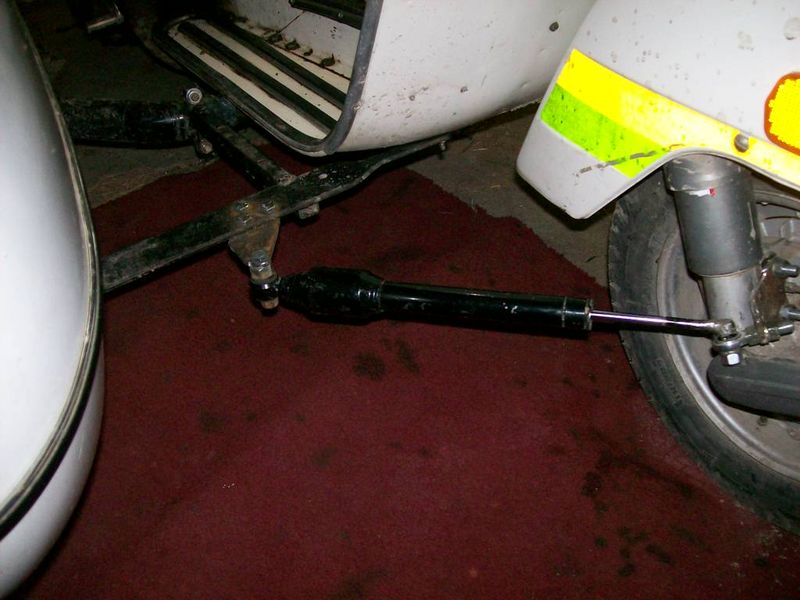 Modern Vespa steering damper or stabilizer on partner sidecar