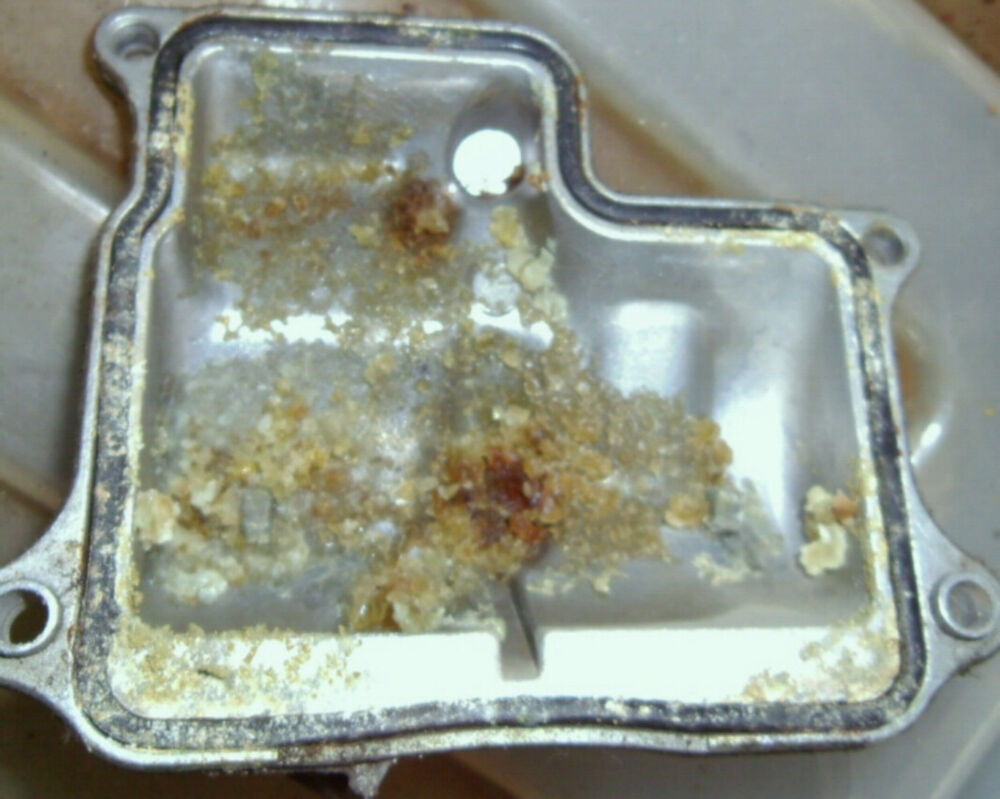 Modern Vespa How difficult is it to drain a gts 250 gas tank?