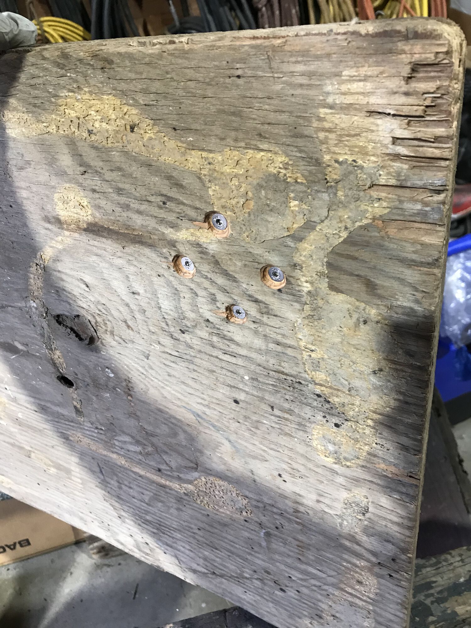 underneath side of work bench. Note the 4 screws.