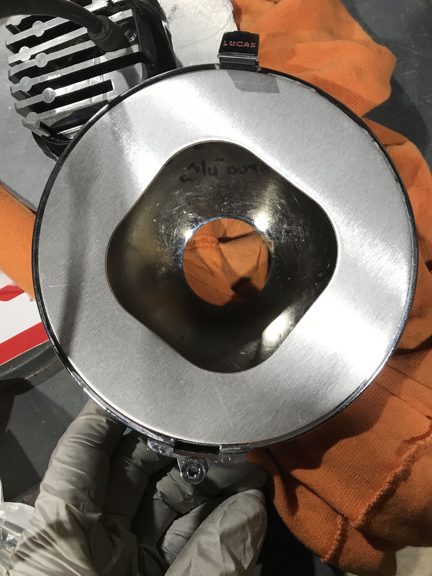 the locating ring plate will juuuust fit inside the Lucas light housing.