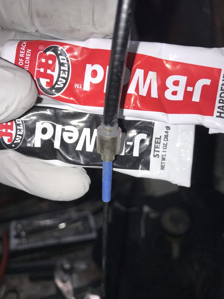 there's a steel rod that's pushed through the top hat, and into the outer cable (in order to keep the epoxy out, as well as to keep the top hat centered with the ferrule).