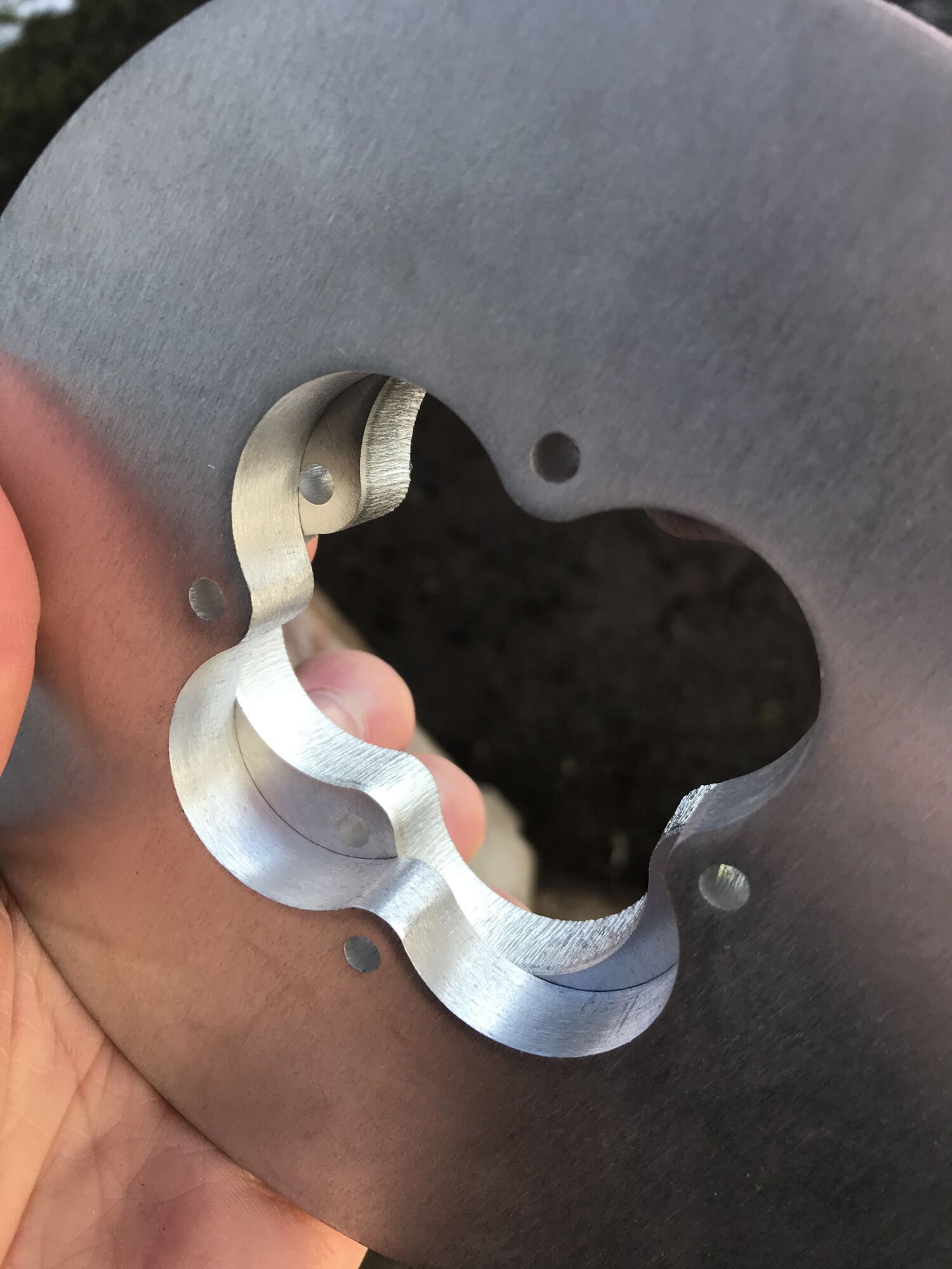 1/2" thick aluminum. I did use a small drum sander to smooth out the rough water jet cuts.