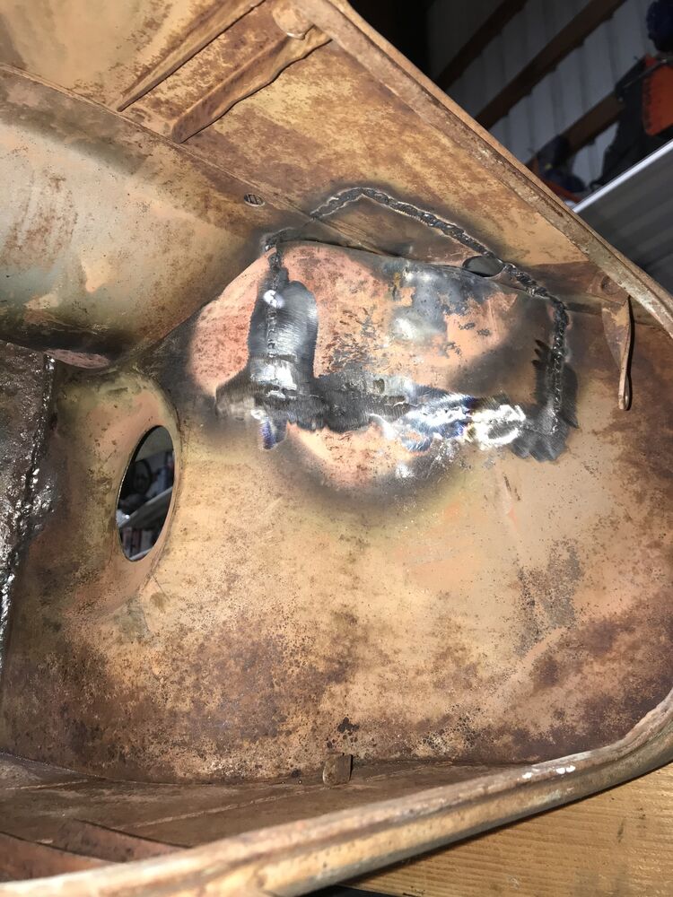 pic of where the fuel tank will reside. There was a fair amount of massaging with heat and a hammer in order to get clearance for both the carb box, air filter screen, and bottom of the fuel tank.