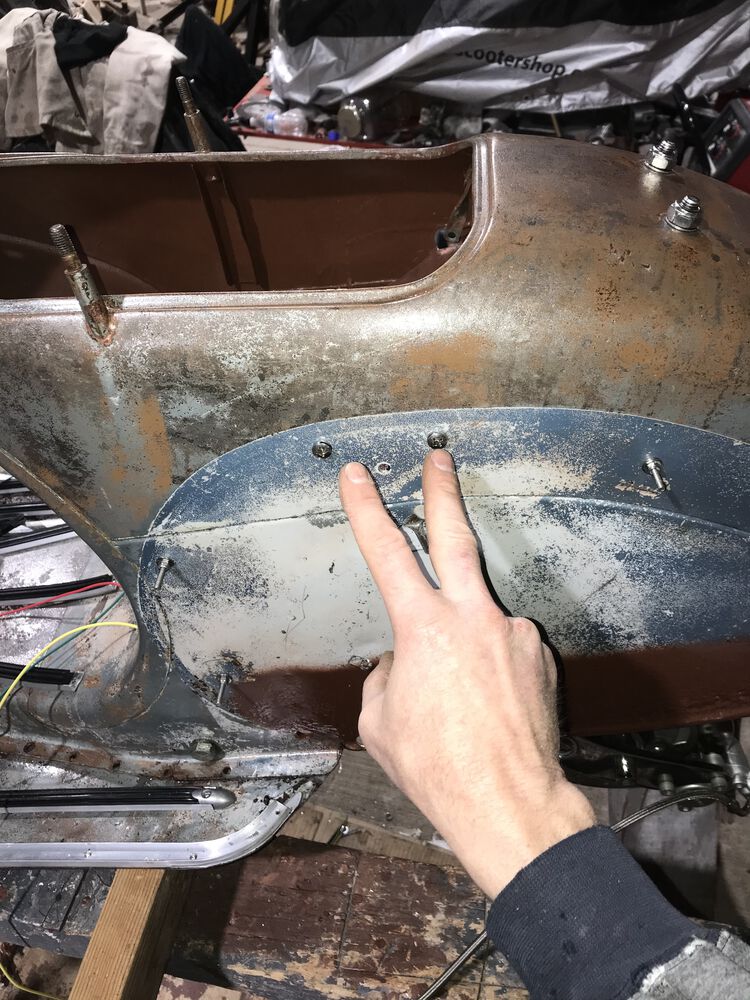 The two regulator mounting screws are just low enough to be below the cowl rubber.