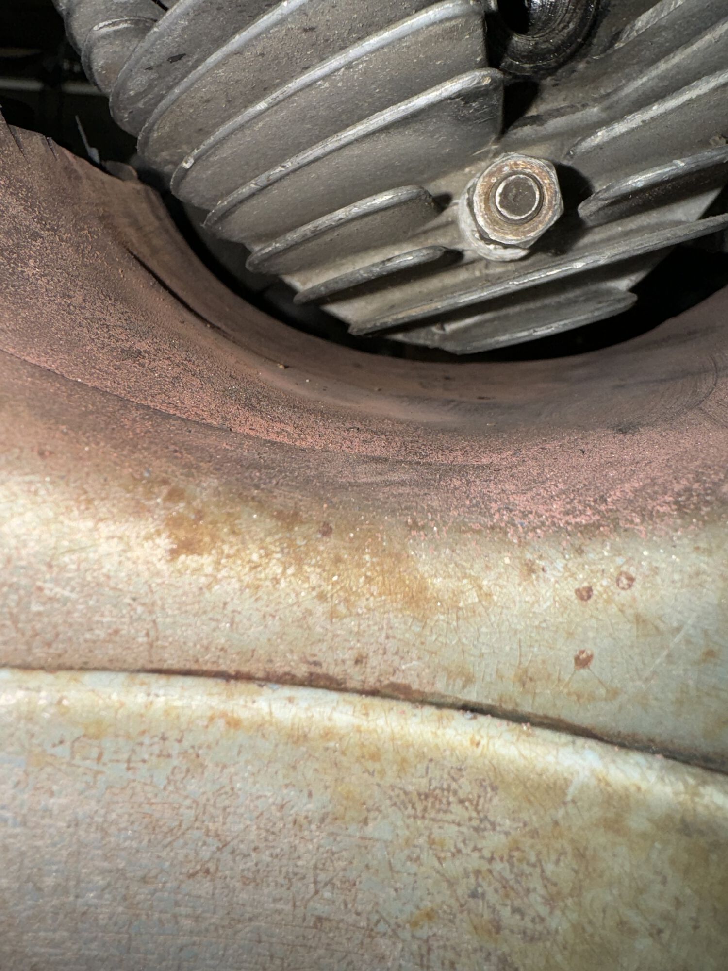 this area required heating and beating to gain more clearance for the cylinder and cylinder shroud. I'm guessing an additional 1/4" was required.