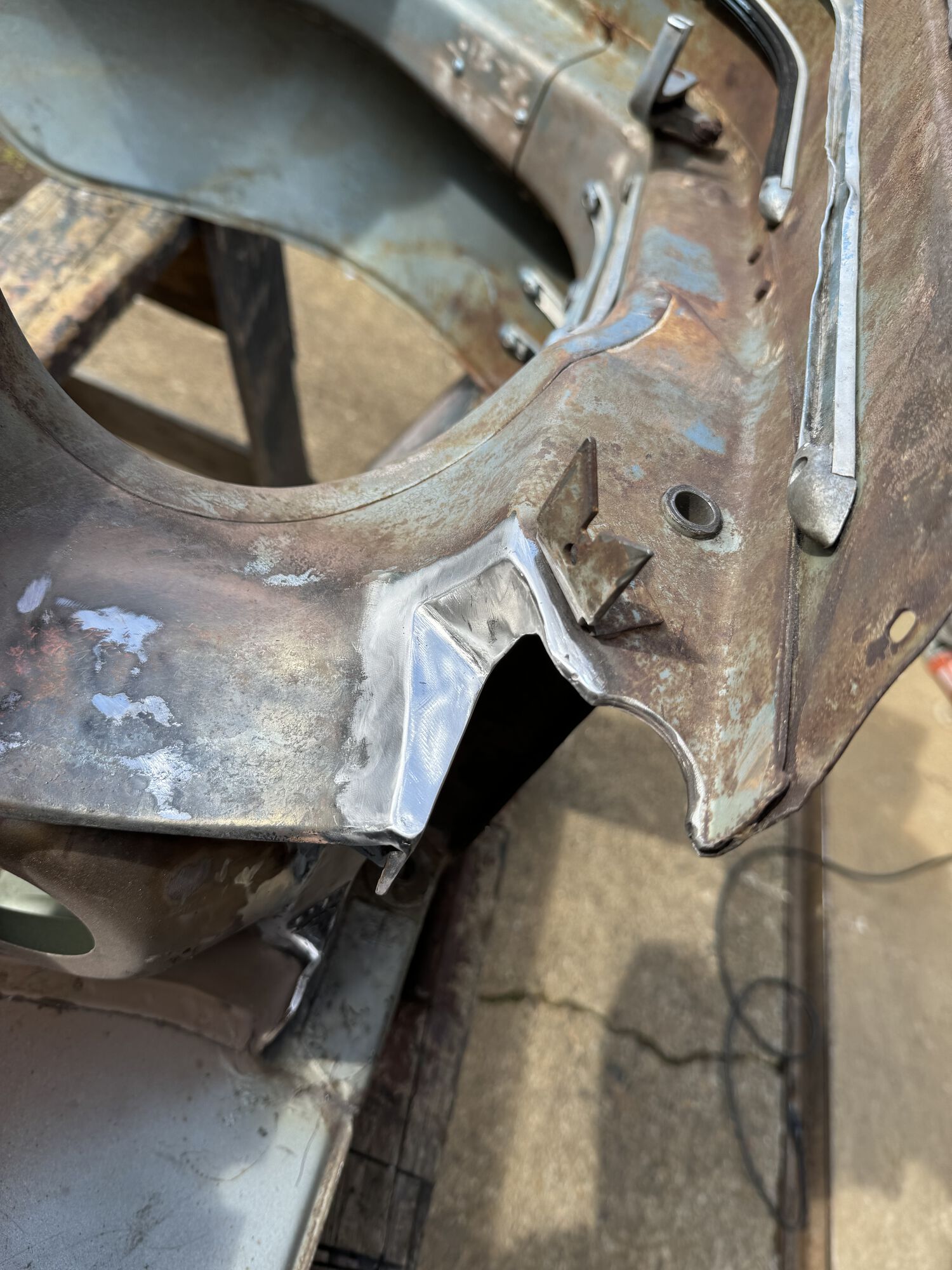 said metal piece welded into place and sanded down to be smooth
