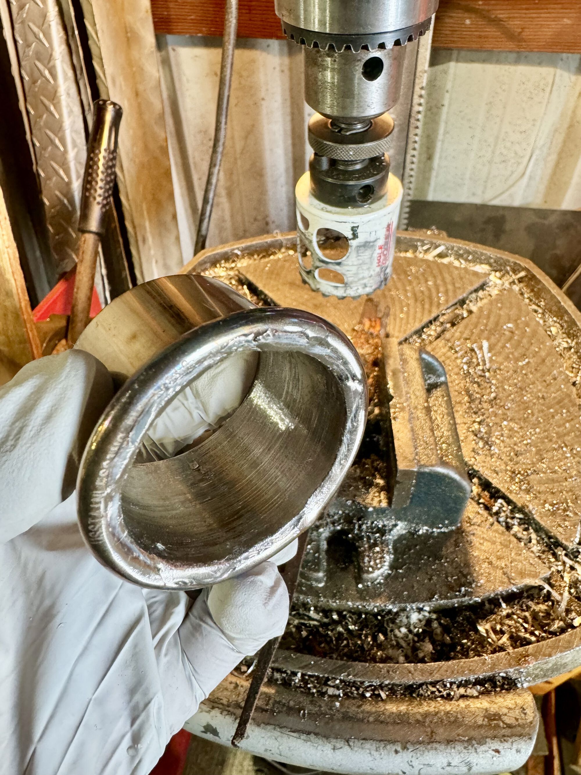 the fastest way to clean up my welds was to use a 1-7/8" hole saw. It was a bit sketchy with the drill press, but it made for short work!