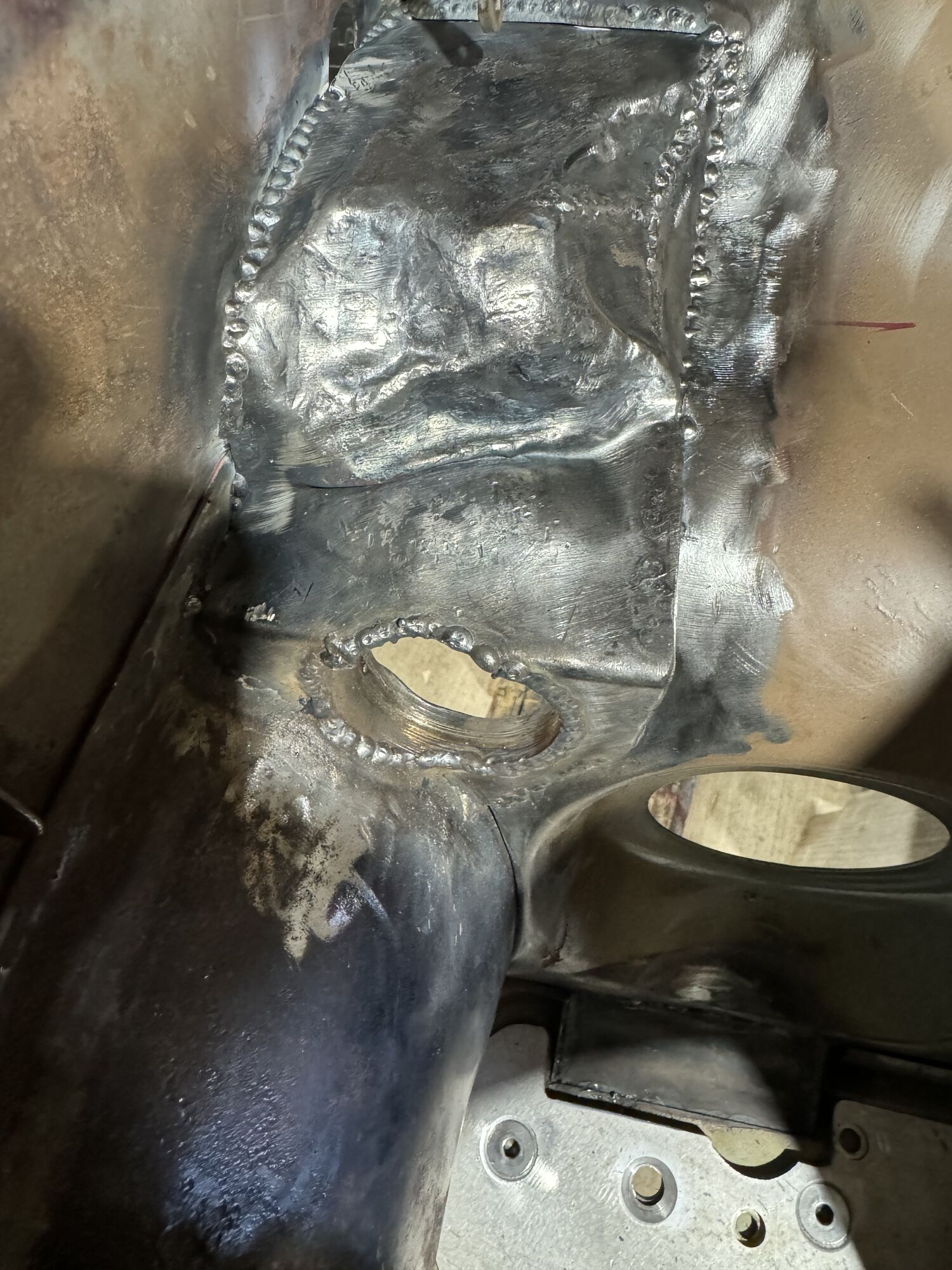tube adapter welded into place. Not shown, but later i did use a 1-7/8" hole saw again to clean the weld beads up a bit