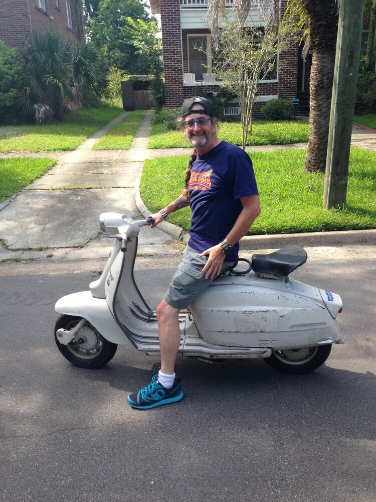 John picking up the scooter.