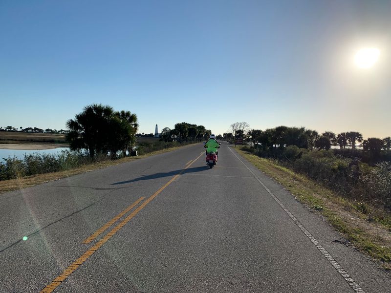 Ken riding ahead of me with the lighthouse in the distance